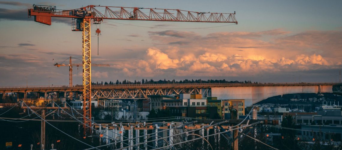A beautiful view of a construction site in a city during sunset